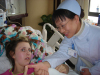 Tori touching thumbs with nurse Nancy Tori touching thumbs with nurse Nancy